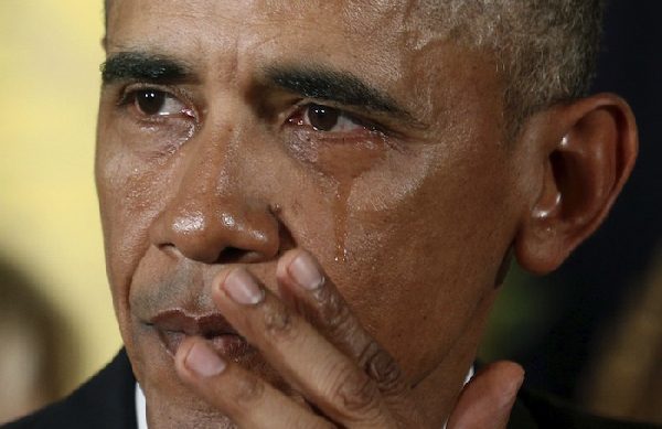Obama, wiping tears, makes new push to tighten gun rules