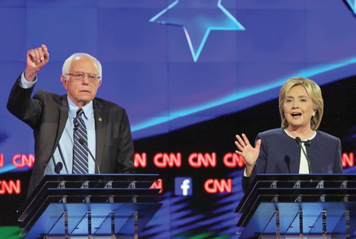 Clinton, Sanders take new combative tone ahead of New Hampshire primary