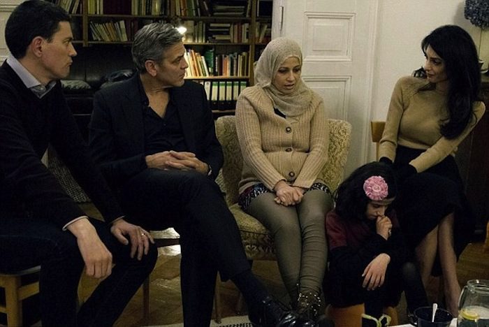 Amal and George Clooney share their immigration stories with refugees