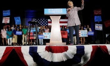 Clinton makes history, secures Democrats' White House nomination