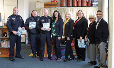 Dearborn Heights police donate winter wear to school children