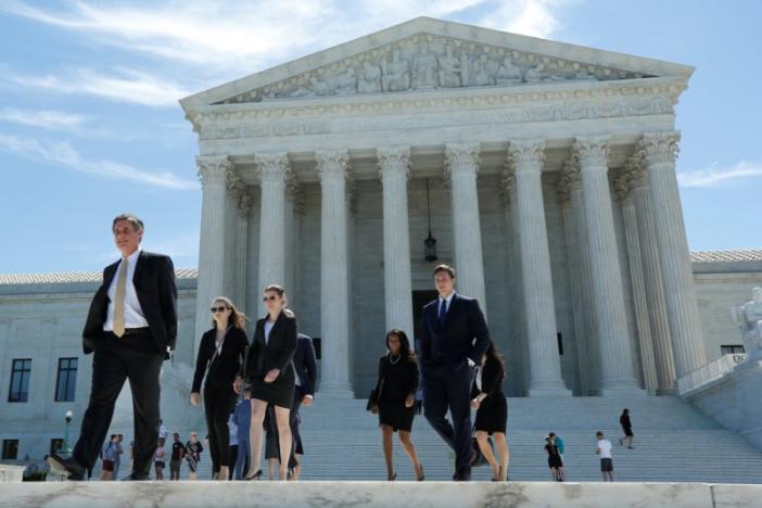 Supreme Court revives travel ban