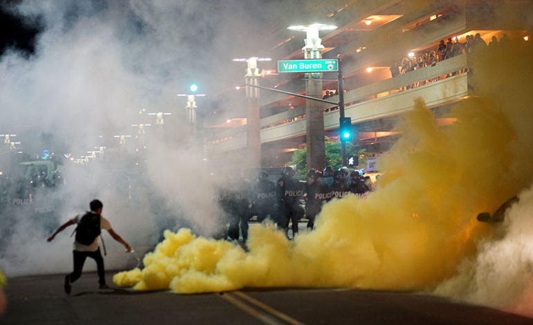Police use pepper spray to disperse protesters at Trump’s Phoenix rally