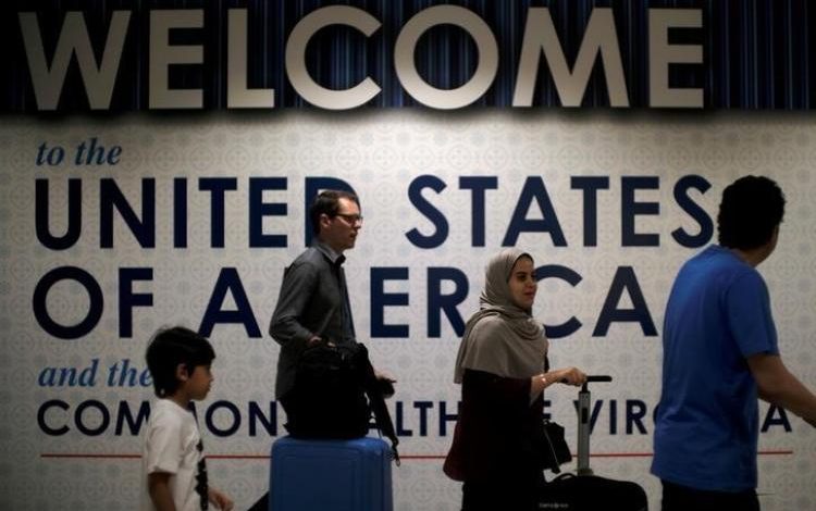 Airlines implement tougher U.S. security rules on incoming passengers