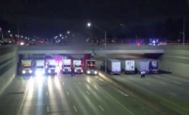 State Police organize 13 semis on I-696 freeway to save suicidal man