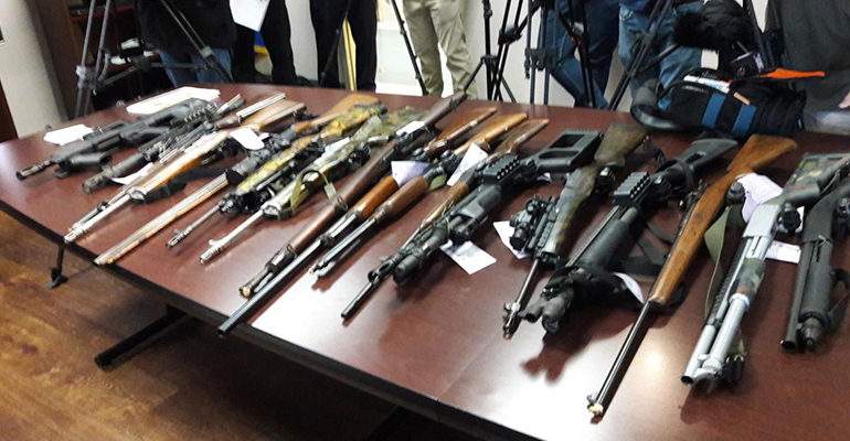 Police officers find weapons, ammo cache during check of licensed dealer