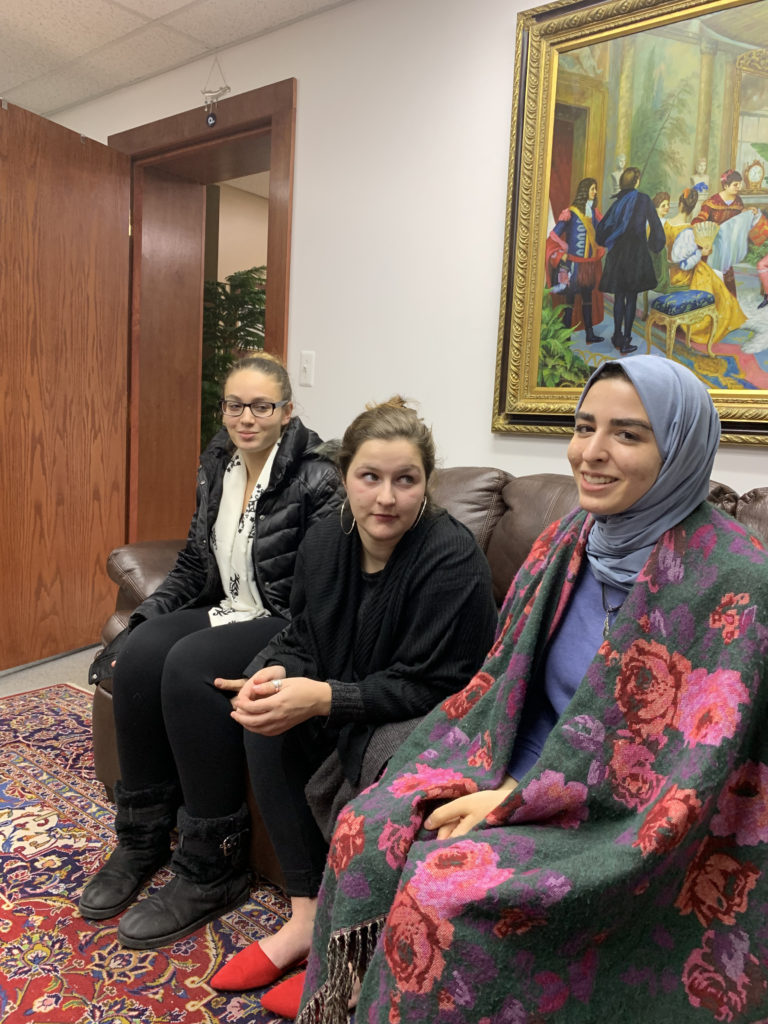 Left to right - SPJ President Jasmine Rabie, Research Chair Jordan Yunker and Vice President Jenin Yaseen speaking with the Arab American News