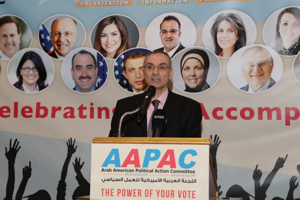 Abed hammoud speaking at one of AAPAC's annual banquet dinners