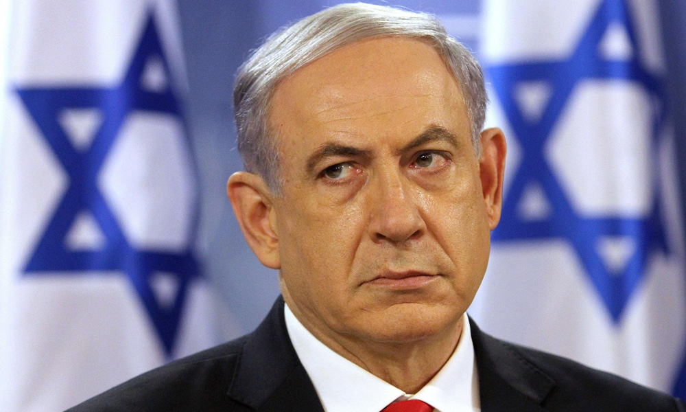 Israeli TV stations showed Netanyahu being escorted off a stage by bodyguards to a shelter after sirens sounded.