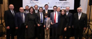 Ali Bydon (front row, fourth from left) and his brother Mohamad Bydon hold awards while surrounded by family and community members at Bint Jbeil Cultural Center, where many were present to recognize their work. All photos: Abbas M. Shehab