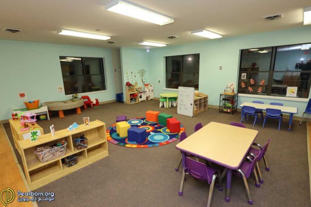 Several mini tables, a play area, and different toys are pictured inside of the Oakman Child Care West Dearborn location Photo: Dearborn.org
