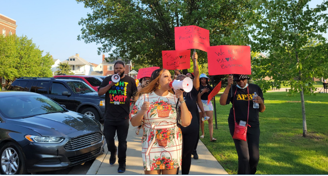 Spa owner Tiara Boyd leads march in front of Hamtramck City Hall on July 27. Photo: Rasha Almulaiki /The Arab American News