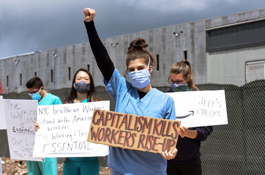 A healthcare worker joins a protest outside of an Amazon fulfillment center in New York, May 1. Photo: Stephanie Keith/Getty Images