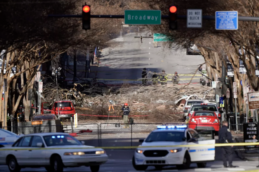 Investigators continue to examine the site of an explosion Sunday, Dec. 27, 2020, in downtown Nashville, Tenn.