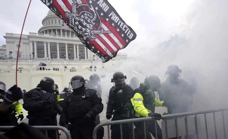Capitol protests result in more than 50 arrests, 14 officers injured and four deaths; state of emergency extended