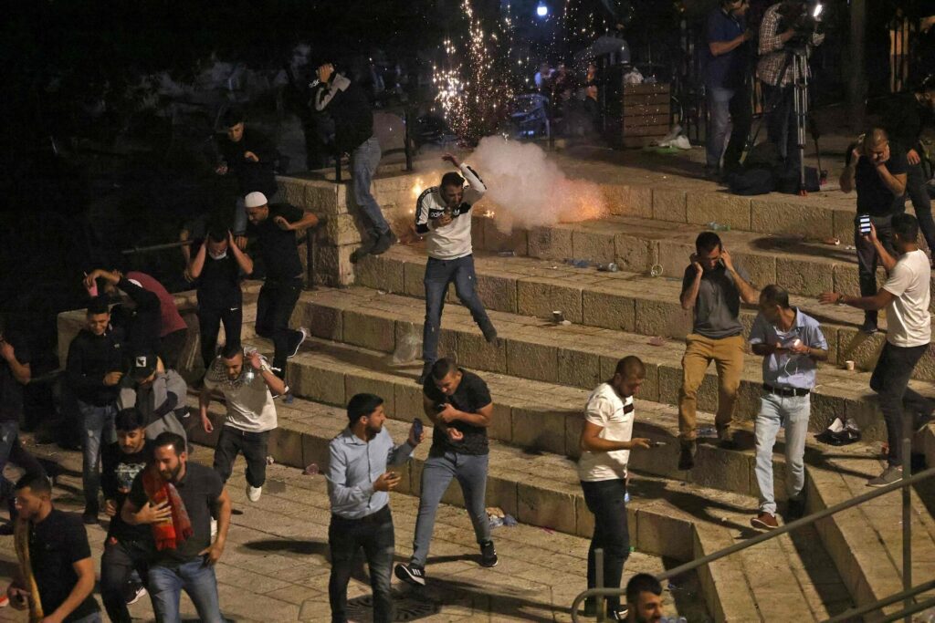 Israeli police forces attack and clear out protesters and worshipers at the Al-Aqsa compound in Jerusalem, May 2021