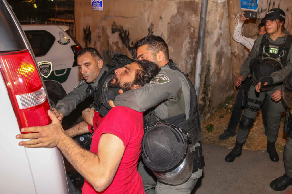 Israeli security forces detain a Palestinian amid ongoing confrontations as Palestinian families face removal from their homes in the Sheikh Jarrah neighborhood of East Jerusalem, on May 4, 2021. Photo: Ahmad Gharabli/AFP