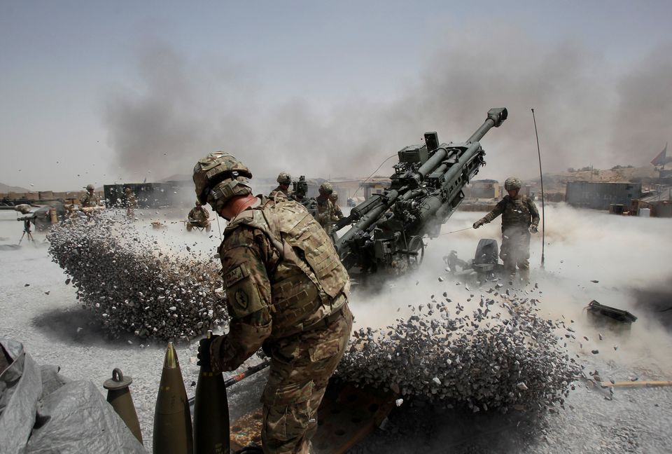 U.S. Army soldiers from the 2nd Platoon, B battery 2-8 field artillery, fire a howitzer artillery piece at Seprwan Ghar forward fire base in Panjwai district, Kandahar province southern Afghanistan, June 12. Photo: Baz Ratner/Reuters