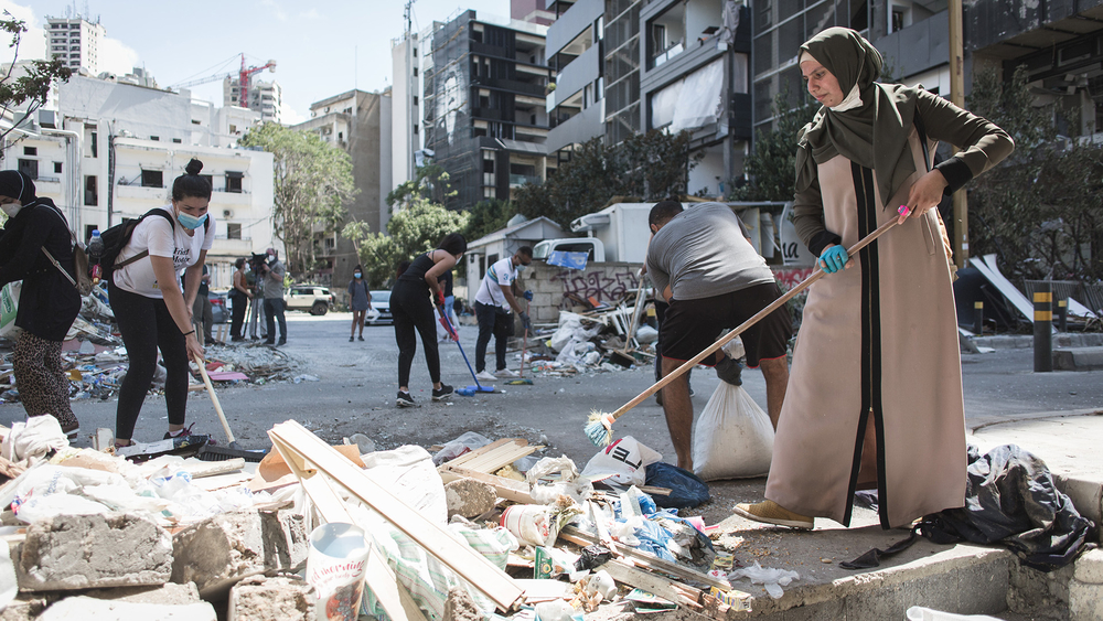 Volunteers clean up the damage in Beirut a few days after the port explosion. Photo: Reuters