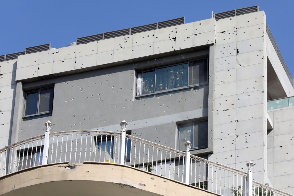 Gun holes are seen on a building after gunfire erupted, in Beirut, Lebanon Oct. 14. Photo: Mohamed Azakir/Reuters 