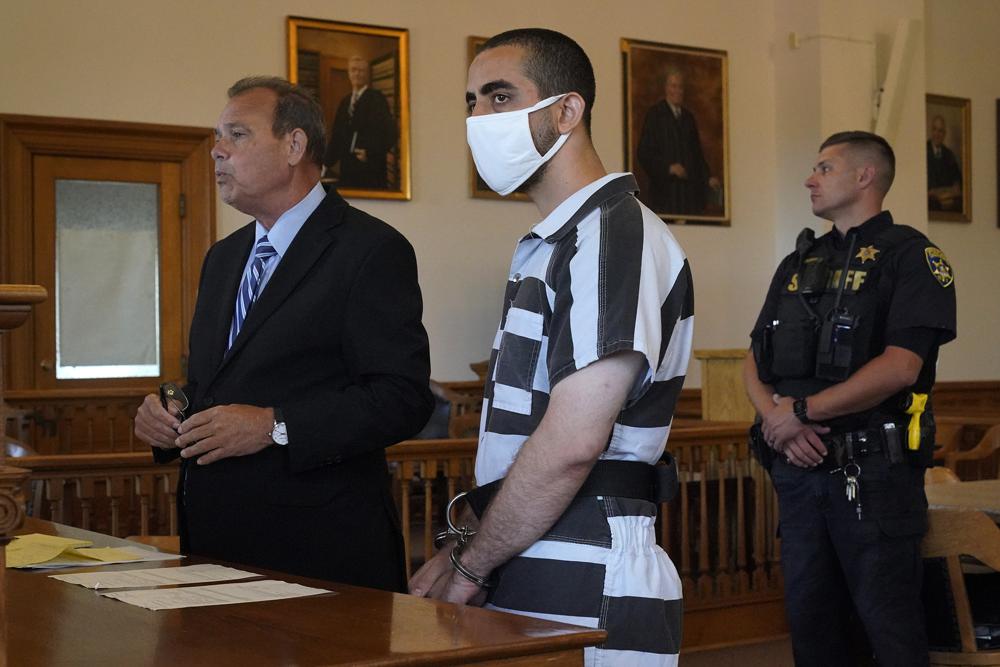 Hadi Matar, 24, center, listens to his public defense attorney Nathaniel Barone, left, addresses the judge while being arraigned in the Chautauqua County Courthouse in Mayville, NY., Saturday, Aug. 13. Matar, accused of carrying out a stabbing attack against “Satanic Verses” author Salman Rushdie, has entered a not-guilty plea on charges of attempted murder and assault. Photo: Gene J. Puskar/AP Photo
