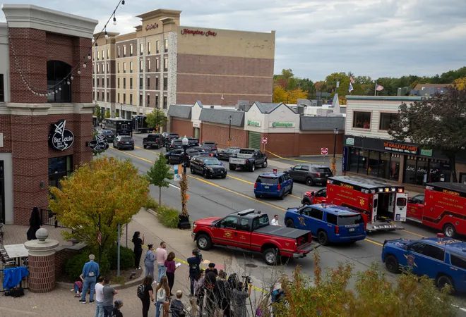 People gather near the Hampton Inn in west Dearborn where an active shooter barricaded himself in his room on Thursday, Oct. 6. Photo: David Rodriguez Munoz/Detroit Free Press