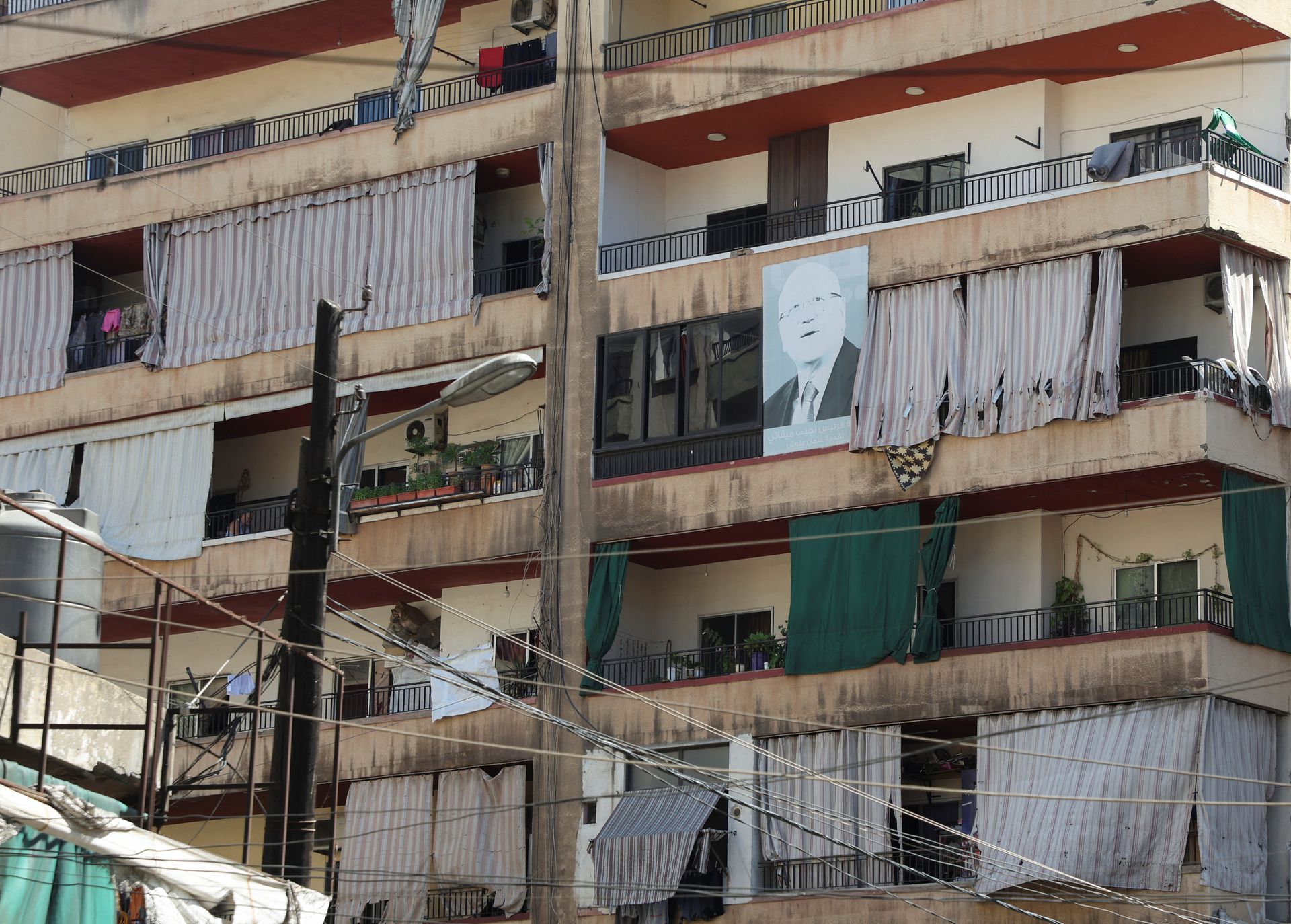 A picture of Lebanon's Prime Minister-designate Najib Mikati is placed on a residential building in the northern city of Tripoli, Lebanon Sept. 23. Photo: Mohamed Azakir/Reuters