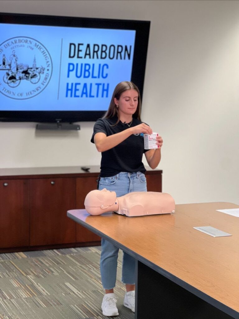 A Dearborn Department of Public Health fellow demonstrates Narcan's use for reversing overdose. Photo: City of Dearborn