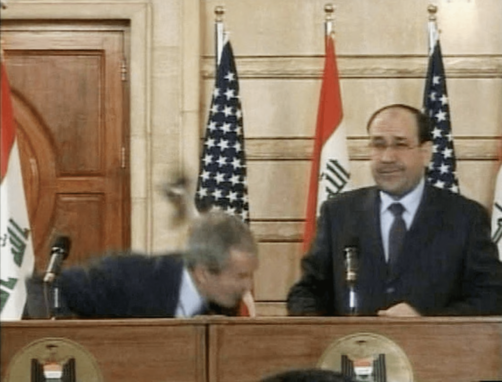 Video frame grab of U.S. President George W. Bush ducking from a shoe during a news conference in Baghdad. REUTERS
