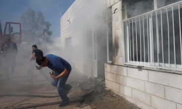 Hundreds of armed Israeli settlers storm Palestinian town setting fires to dozens of homes, vehicles