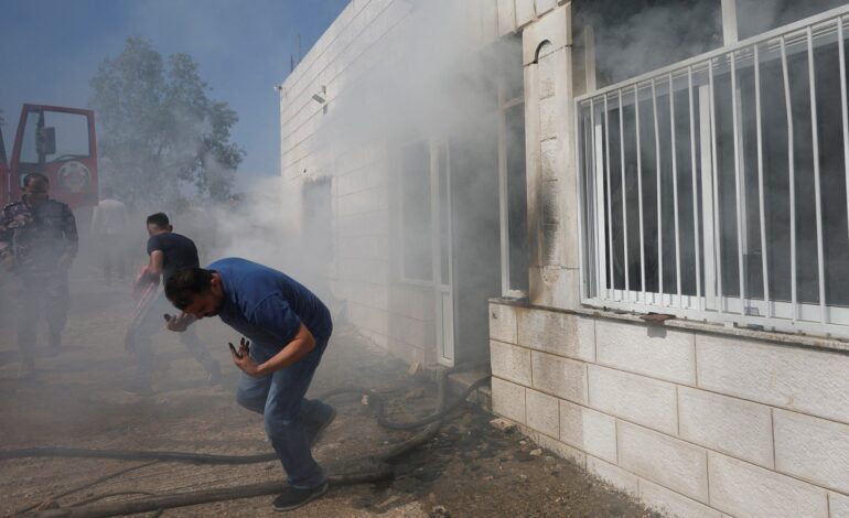 Hundreds of armed Israeli settlers storm Palestinian town setting fires to dozens of homes, vehicles
