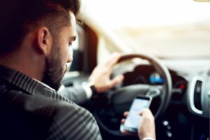 Governor Whitmer signs distracted drivers law prohibiting the use of a cell phone while driving