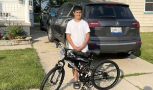 12 year old kid with his new bike