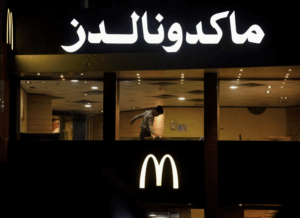 A worker cleans a table in an empty McDonald's restaurant in Cairo, Egypt due to the Israeli war on Gaza on November 20. – REUTERS