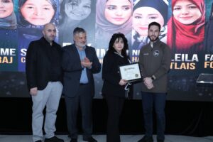 Hassan Baydoun, Abbas Shehab and Mayor Hammoud presenting an award to a relative of the late Fay Awada, who was one of the honorees. – Photos by Abbas Shehab