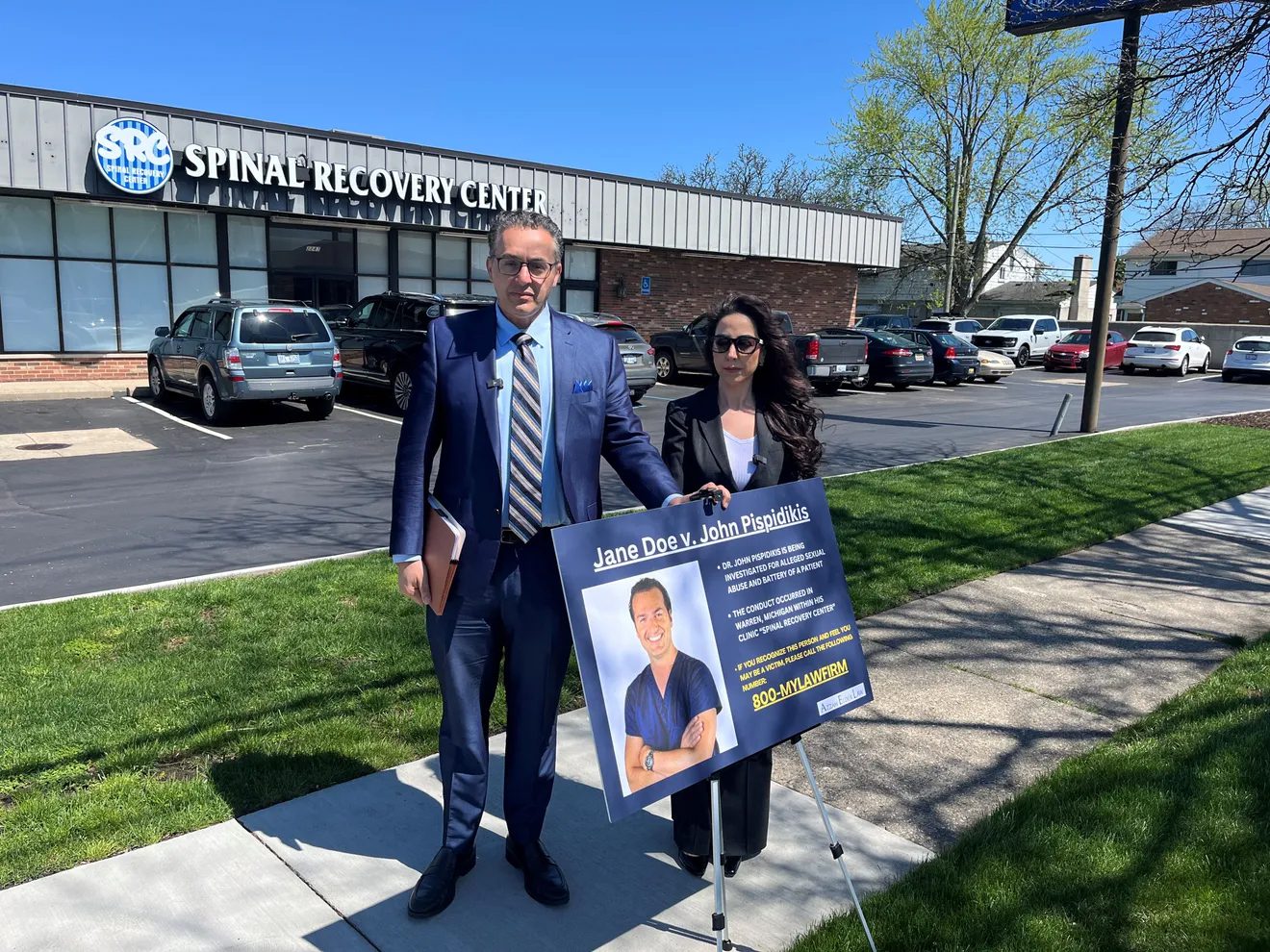 Attorneys Azzam Elder and Nina Korkis-Taweel standing in front of Pispidikis Spinal Recovery Center after holding the press conference on Friday, April 19. – Videograb