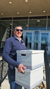 Nasser Beydoun carries boxes that contain over 24,000 signatures to the Bureau of Elections to officially place his name on the ballot for the Michigan Democratic primary in August. - Photo courtesy of Nasser Beydoun campagin