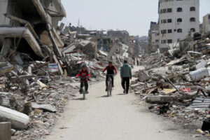 Palestinians ride bicycles past the ruins of houses and buildings destroyed during Israel’s military offensive, amid the ongoing conflict between Israel and Hamas in the northern Gaza Strip, March 31, 2024. – File photo