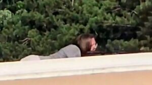 20-year-old gunman Thomas Matthew Crooks was seen lying on his belly aiming the gun. He shot at Trump from the rooftop over 130 yards away. – Videograb