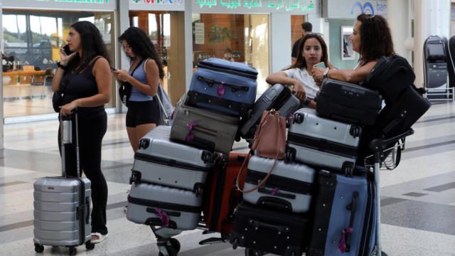 Travelers in Lebanon attempting to leave the country, airlines halt flights to Beirut amid rising tensions