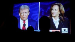 Donald Trump and Kamala Harris are shown on screen during a debate watch party at the Cameo Art House Theatre in Fayetteville, North Carolina, on Tuesday, Sept. 10. – Screegrab