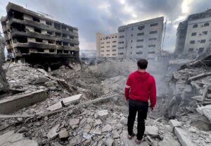  A man looks at destroyed buildings hit by Israeli airstrikes in the southern suburbs of Beirut, Lebanon, on October 7. - Photo by AP