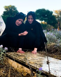 Dr. Soma Baroud and her niece visit the grave of a loved one. – Photo | X | @ZarefahBaroud