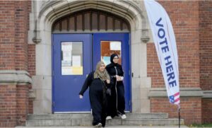 Voters depart a polling place at McDonald Elementary School, Nov. 5, in Dearborn. – Photo by AP