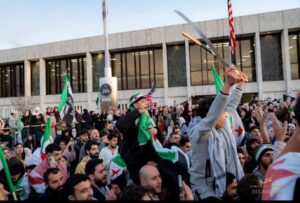 A crowd of Syrian Americans gathered at the Henry Ford Centennial Library in Dearborn on Sunday, December 7 to celebrate the fall of Assad regeme in Syria. – Photo by Tareq Adam