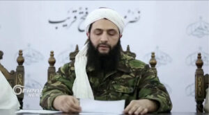 Then-Syrian Islamist rebel group Nusra Front leader Abu Mohammed al-Golani speaks at an unknown location in this still image from 2016 file video obtained December 5, 2024. Orient TV/Reuters TV