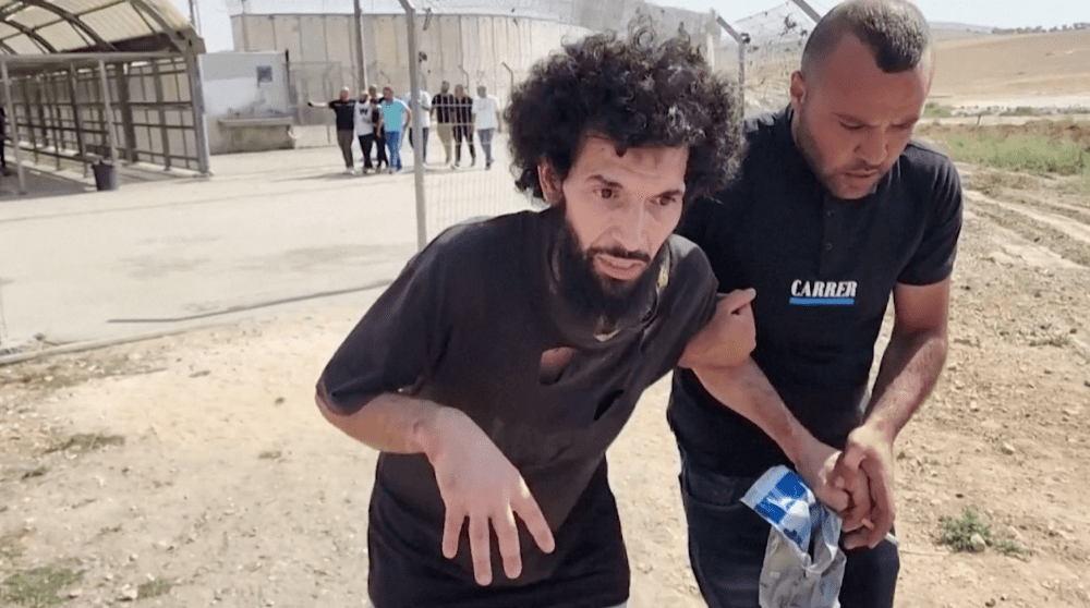 In this screengrab obtained from a Reuters video, Palestinian prisoner Moazaz Obaiyat, released from an Israeli jail, walks near Hebron in the Israeli-occupied West Bank, July 8, 2024.