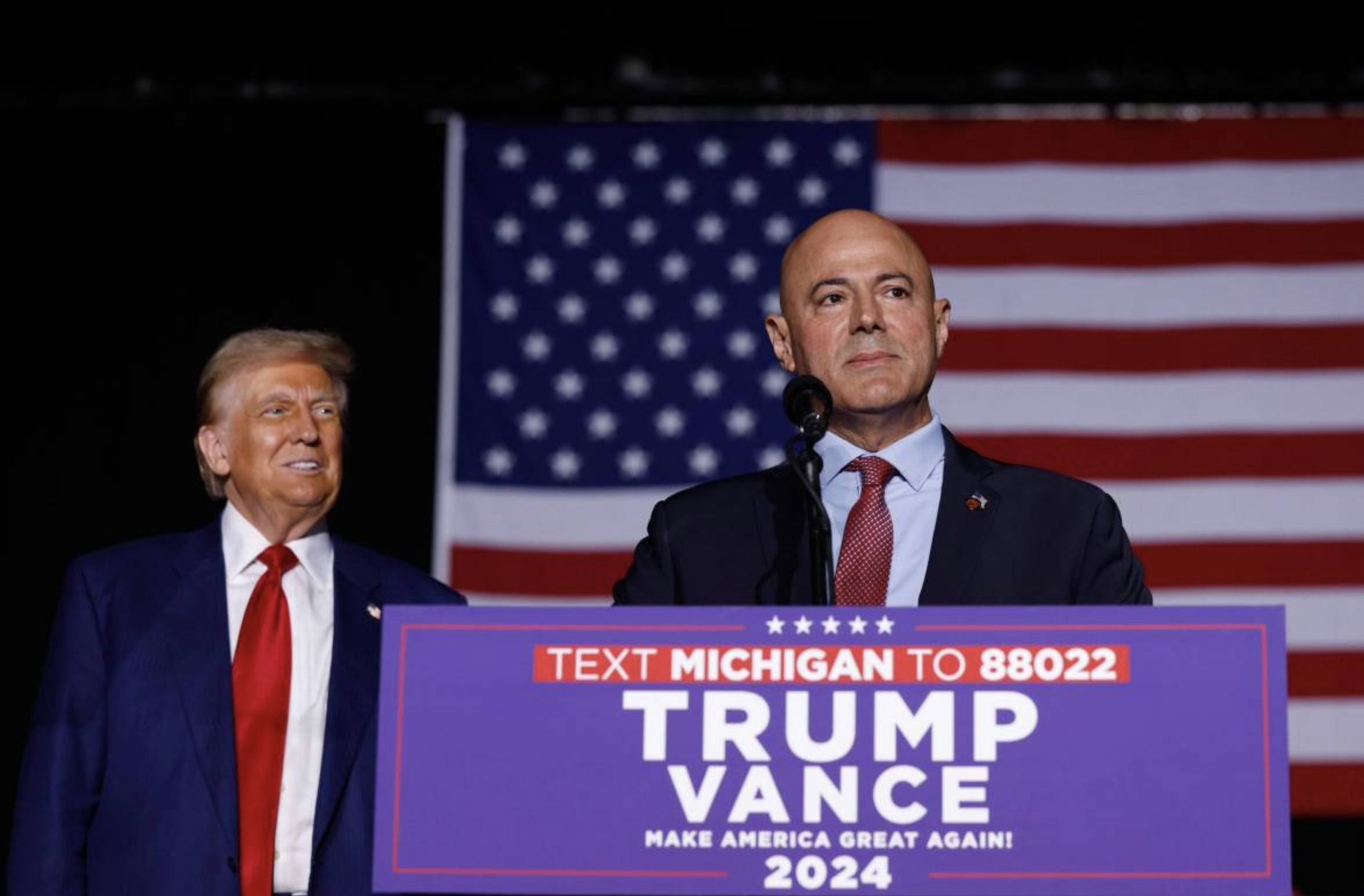 Dearborn Heights, Michigan, Mayor Bill Bazzi speaks as Republican presidential nominee, former U.S. President Donald Trump listens during a campaign rally at Suburban Collection Showplace on October 26, 2024 in Novi, Michigan