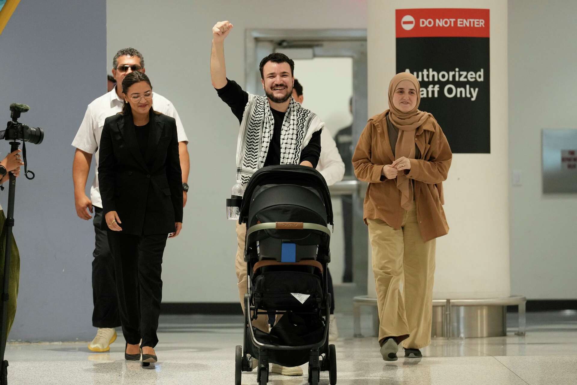 Mahmoud Khalil, center, reacts alongside his wife, Noor Abdalla, right, upon arriving at Newark International Airport , Saturday, June 21, 2025, in Newark, N.J. – Photo by AP
