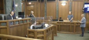 Suspect Anthony James standing in the 19th District Court in Dearborn before Judge Mark Somers on Monday, August 18. – Videograb